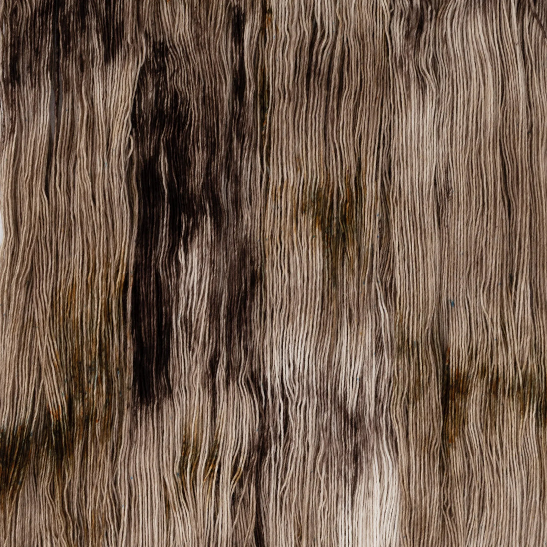 Sysleriget hand dyed yarn in single ply merino wool in the color Chocolate Chip.