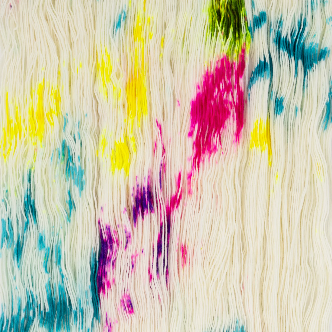 Sysleriget hand dyed yarn in single ply merino wool in the color Unicorn Party.