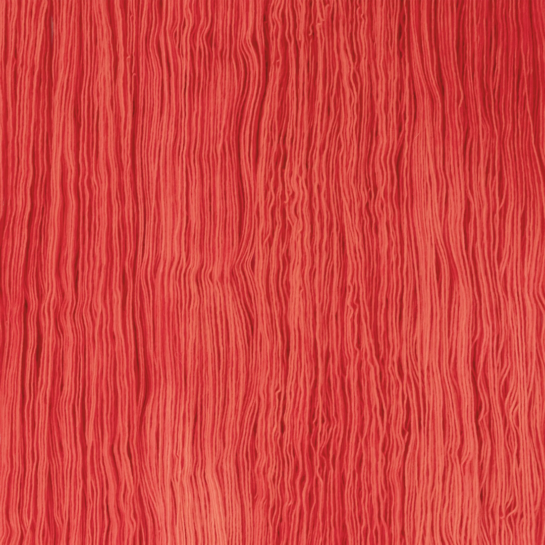 Sysleriget hand dyed yarn in single ply merino wool in the color Wild Poppy.